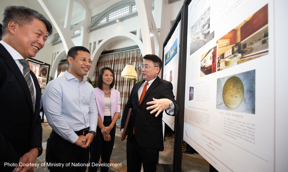 Group photo from the 2019 Architectural Heritage Awards ceremony with posters in the background.